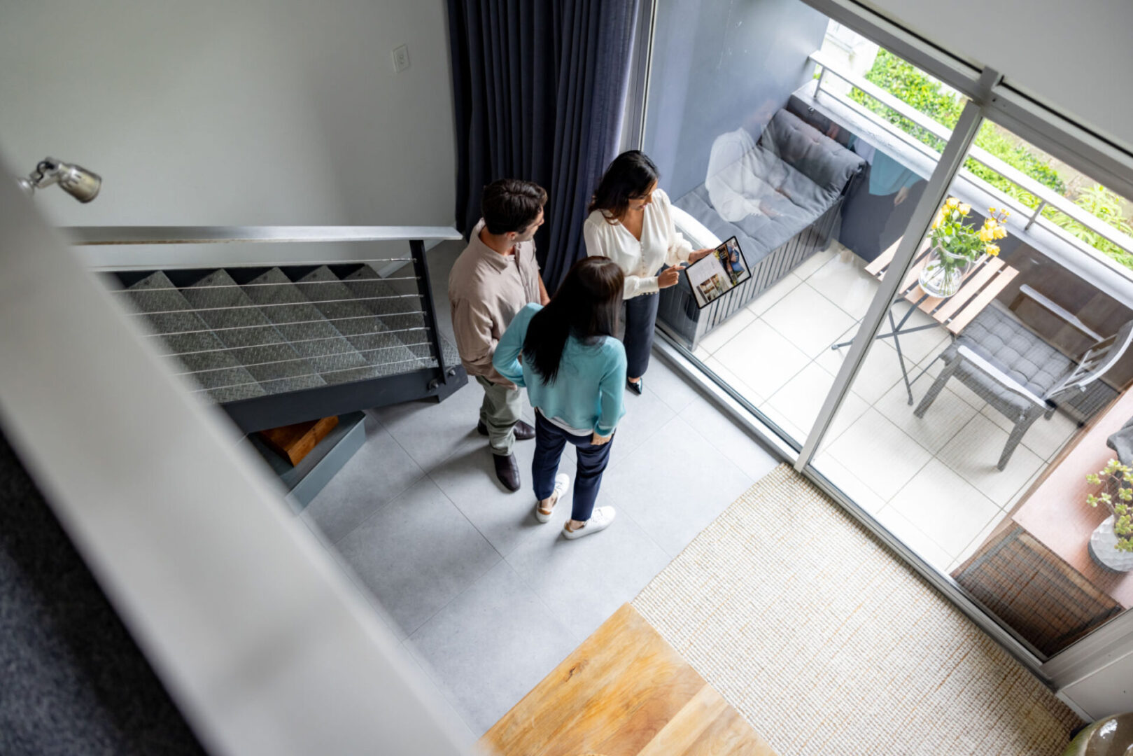 People viewing modern home interior from above.